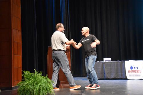 Dr. Nichols shaking hands with Foley